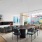 spacious lounge room with a modern fireplace and seating