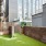 pet area with green turf and wooden fencing